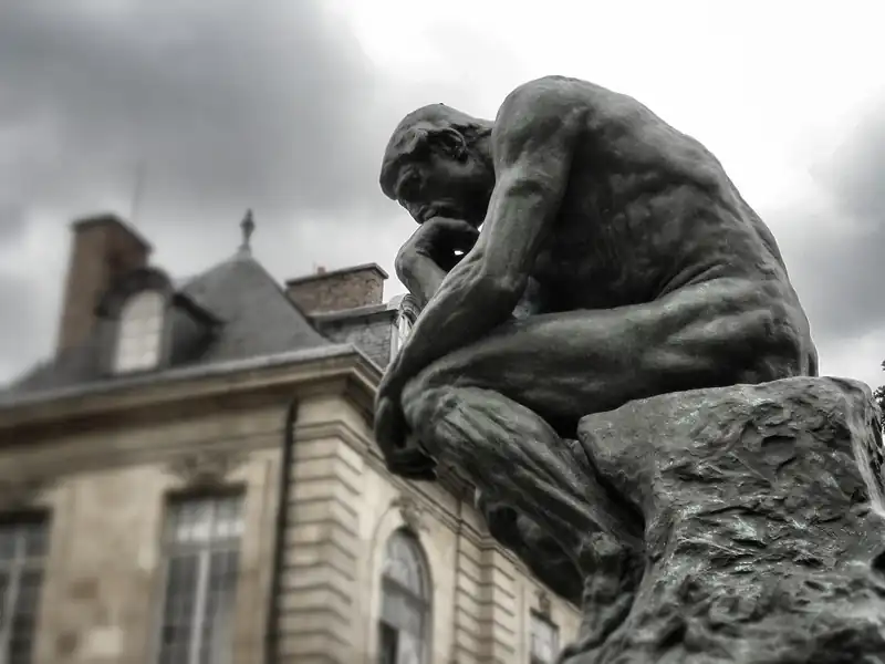 Bronze sculpture of The Thinker by Rodin, symbolizing deep abstract philosophical contemplation